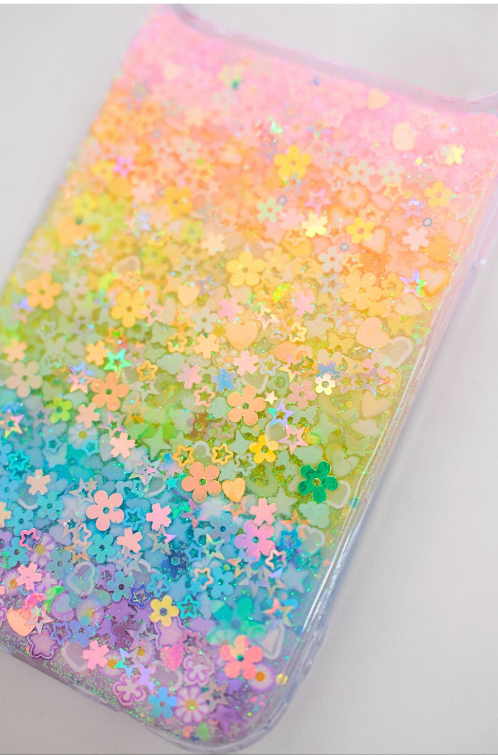 Phone case with colorful monochromatic rainbow pattern on a white background