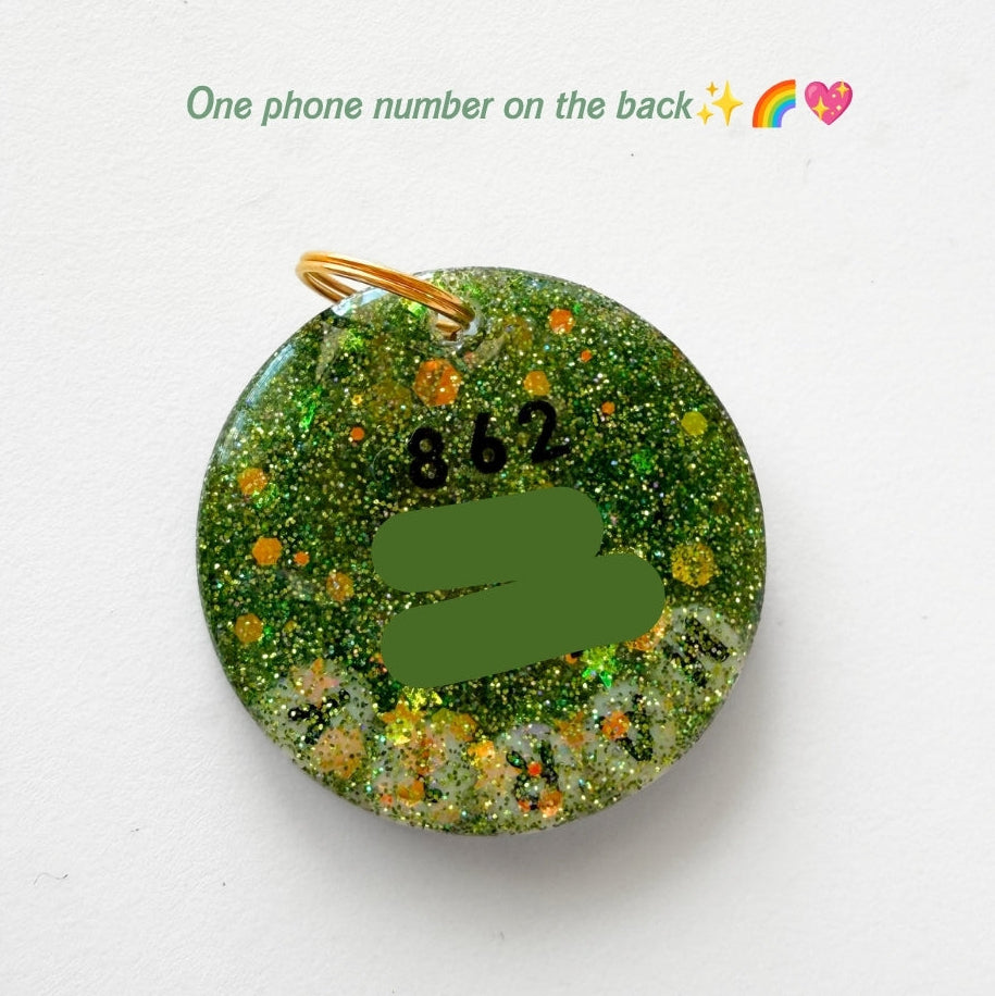 A round green glitter phone case with a gold metal loop at the top, displayed on a white background with a text overlay at the top.