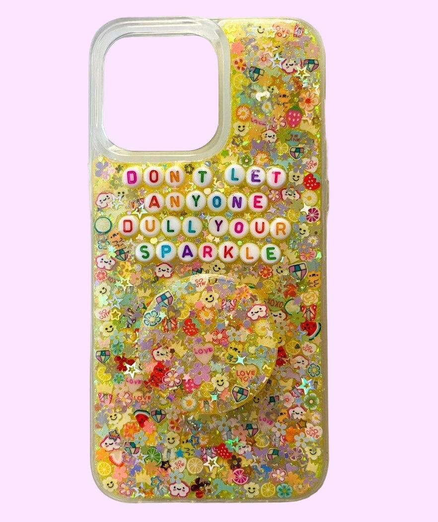 Phone case with colorful design and text 'Don't let anyone dull your sparkle' on a white background