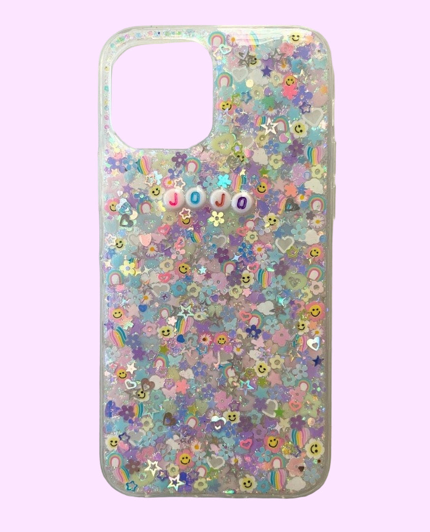 phone case with iridescent glitter and pastel charms 